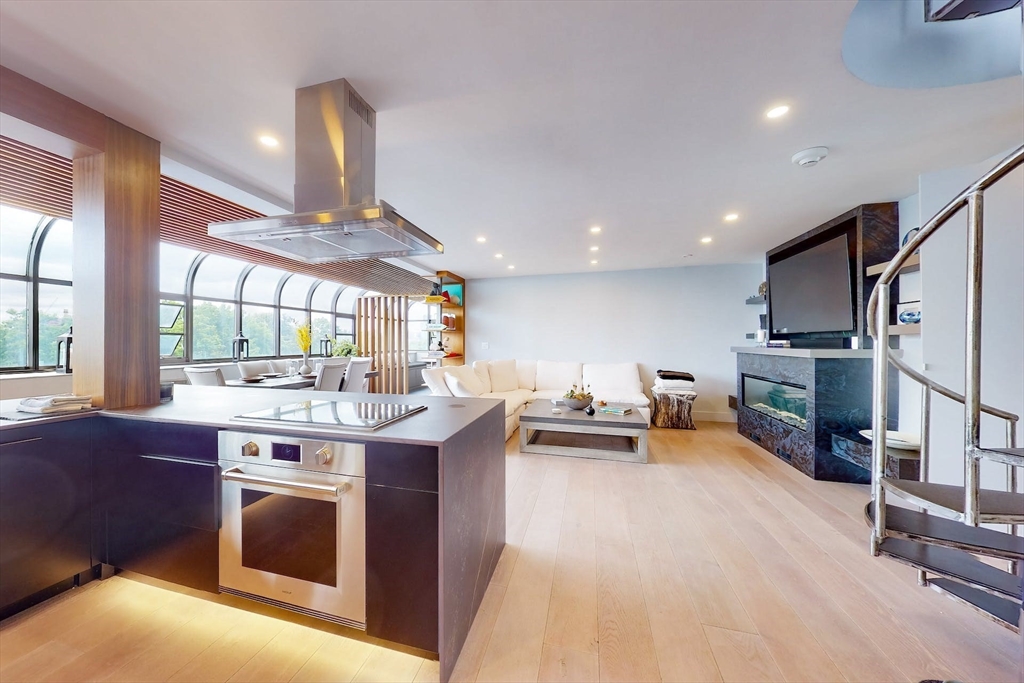 270 Beacon Street, Unit H5 Boston, MA 02116 - Photo 16 of 38 a kitchen with kitchen island a stove and a refrigerator