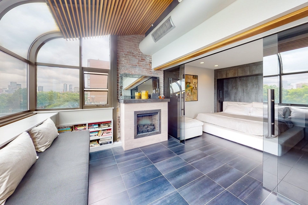 270 Beacon Street, Unit H5 Boston, MA 02116 - Photo 20 of 38 a living room with furniture and a fireplace