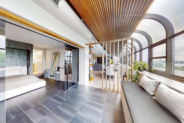 a lobby with furniture and a large window