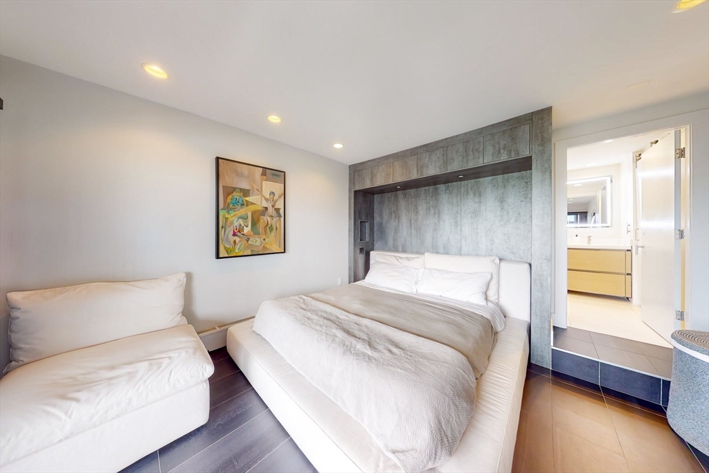 270 Beacon Street, Unit H5 Boston, MA 02116 - Photo 23 of 38 a bed room with a bed and a couch