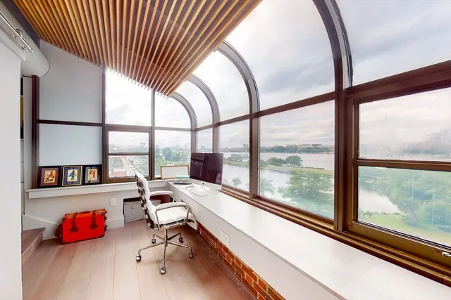 a room with gym equipment and a large window