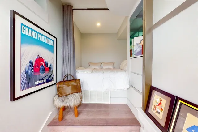 a room with furniture and painting on the wall