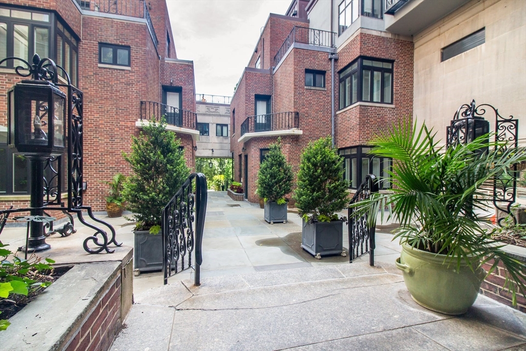 270 Beacon Street, Unit H5 Boston, MA 02116 - Photo 33 of 38 a view of a patio with plants and chairs
