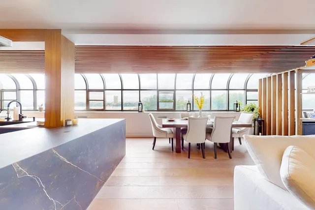 a view of a dining room with furniture window and outside view