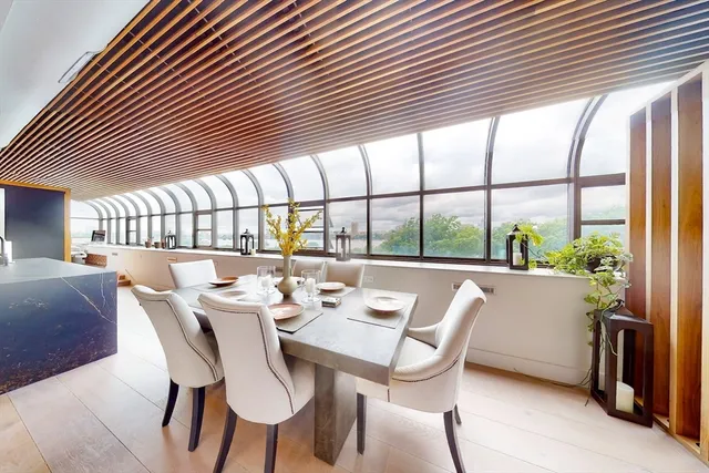 a view of a dining room with furniture window and outside view