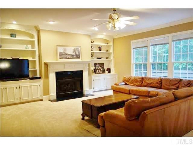 11320 Honeycutt Road, Unit LOT12 Raleigh, NC 27614 - Photo 2 of 25 Large family room features lots of built-in shelving & cabinets & a gas log fireplace. Family Room