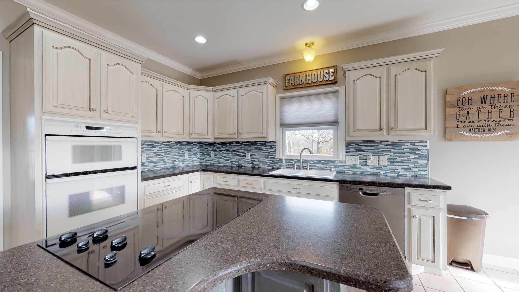 7450 Delbridge Road Murfreesboro, TN 37127 - Photo 17 of 50 a kitchen with granite countertop a stove sink and cabinets
