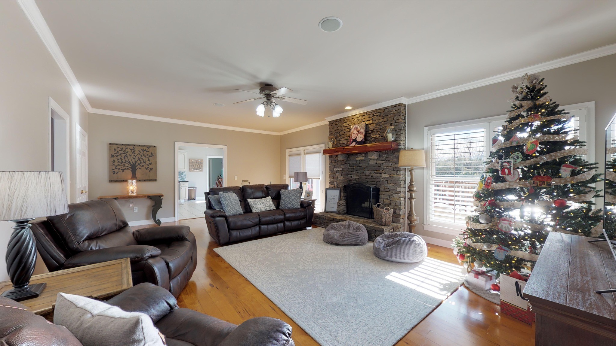 7450 Delbridge Road Murfreesboro, TN 37127 - Photo 22 of 50 a living room with furniture potted plant and a fireplace