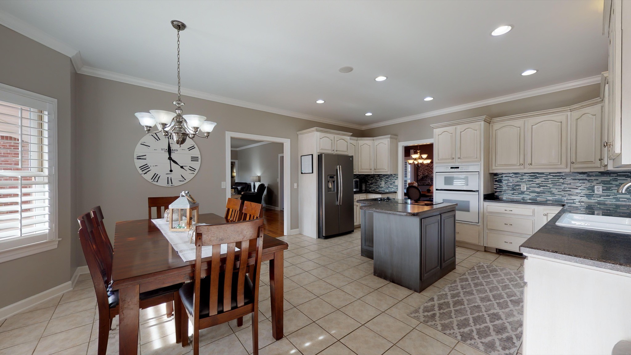 7450 Delbridge Road Murfreesboro, TN 37127 - Photo 25 of 50 a view of a dining room with furniture and a chandelier