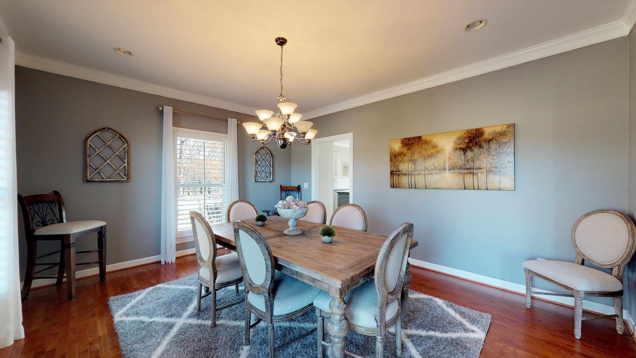 7450 Delbridge Road Murfreesboro, TN 37127 - Photo 29 of 50 a view of a dining room with furniture wooden floor and a chandelier