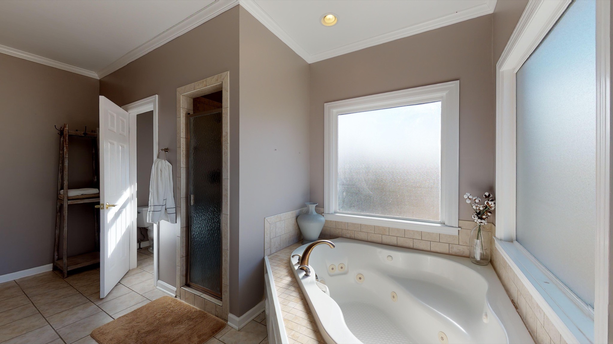 7450 Delbridge Road Murfreesboro, TN 37127 - Photo 32 of 50 a bathroom with a tub and a shower