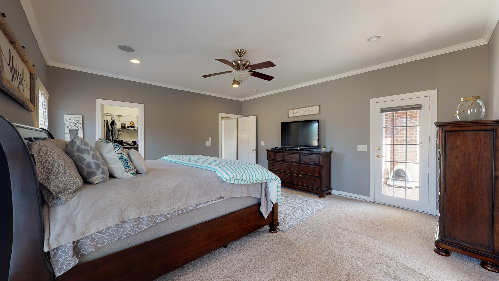 7450 Delbridge Road Murfreesboro, TN 37127 - Photo 34 of 50 a large bedroom with a bed and a television in it