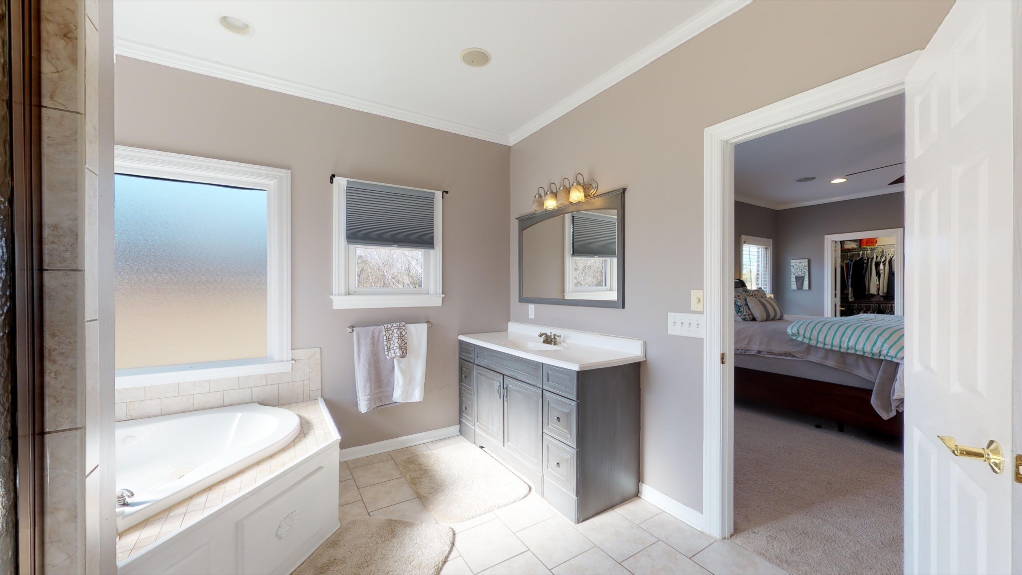 7450 Delbridge Road Murfreesboro, TN 37127 - Photo 35 of 50 a bathroom with a tub sink and mirror