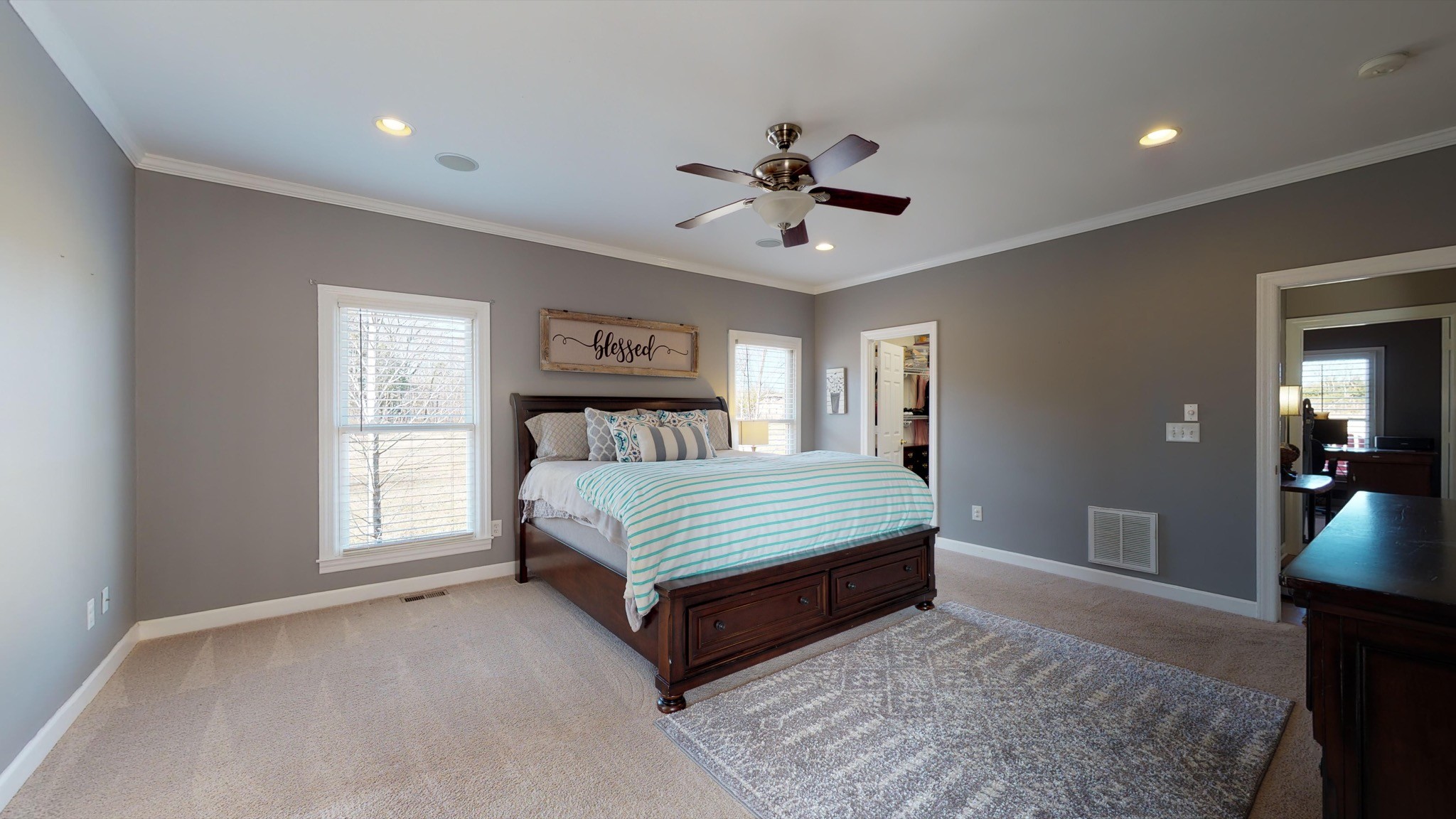 7450 Delbridge Road Murfreesboro, TN 37127 - Photo 36 of 50 a bedroom with a bed and a chandelier