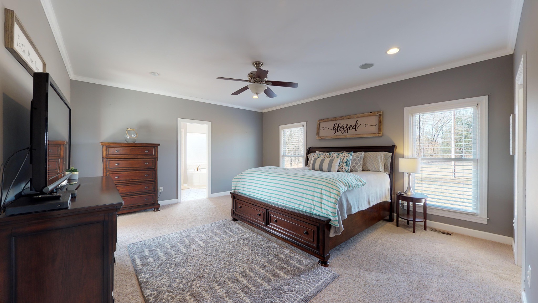 7450 Delbridge Road Murfreesboro, TN 37127 - Photo 37 of 50 a bedroom with a bed and a flat screen television