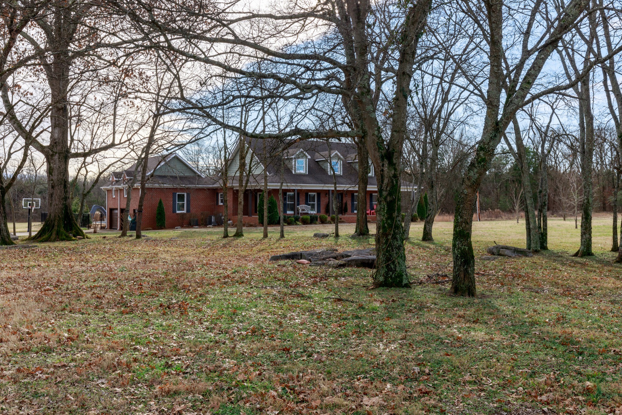 7450 Delbridge Road Murfreesboro, TN 37127 - Photo 7 of 50 a front view of a house with a yard