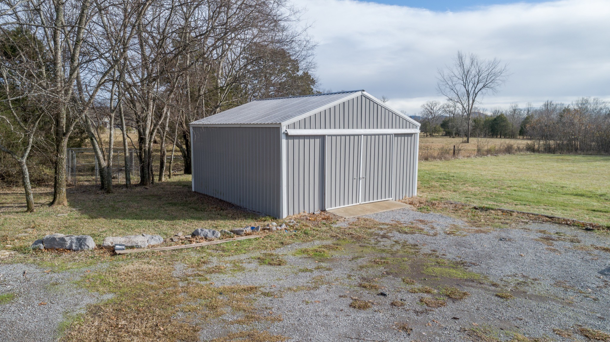 7450 Delbridge Road Murfreesboro, TN 37127 - Photo 8 of 50 a view of a wooden house with a yard