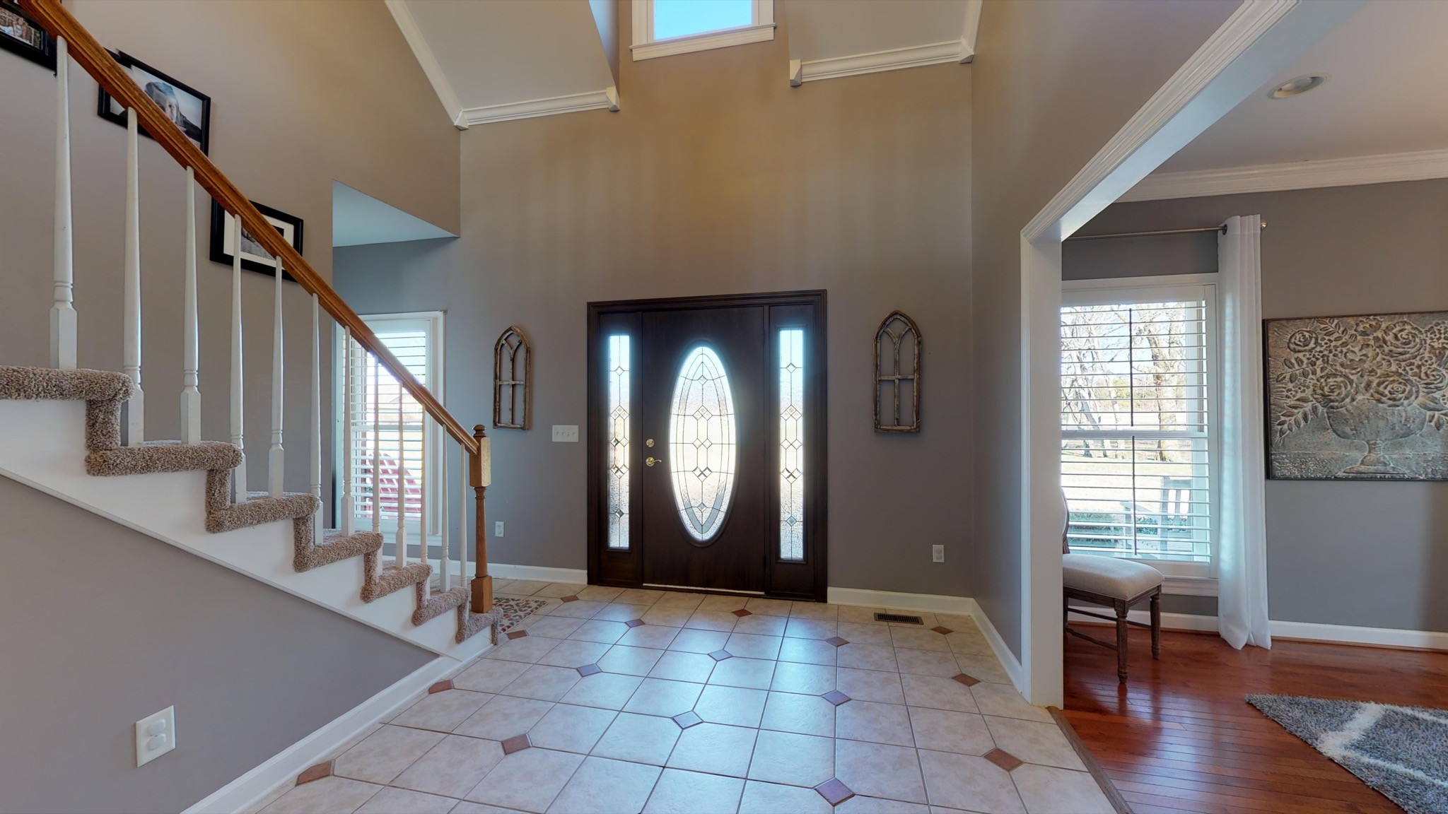 7450 Delbridge Road Murfreesboro, TN 37127 - Photo 9 of 50 a view of an entryway with wooden floor and stairs