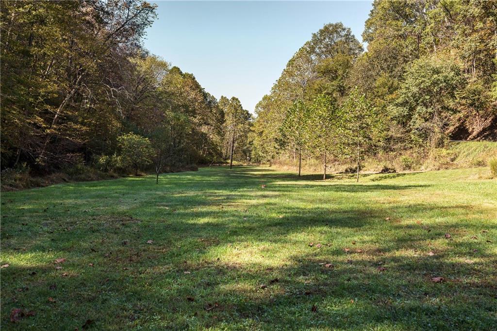 476 Hewitt Run Wind Ridge, PA 15380 - Photo 17 of 28 a view of a grassy field with trees