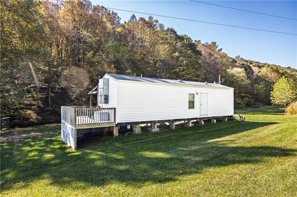 476 Hewitt Run Wind Ridge, PA 15380 - Photo 2 of 28 a view of a white house with a big yard