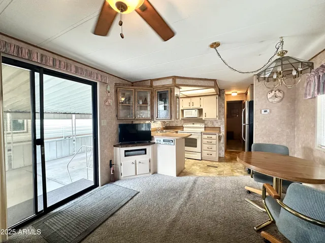 a kitchen with stainless steel appliances granite countertop a stove and a refrigerator