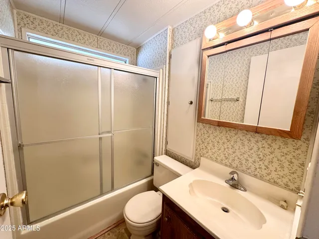 a white refrigerator freezer sitting in a kitchen