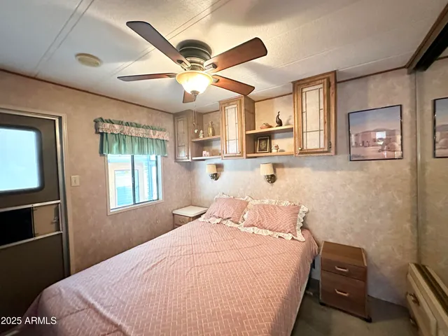 a bathroom with a shower and a glass door