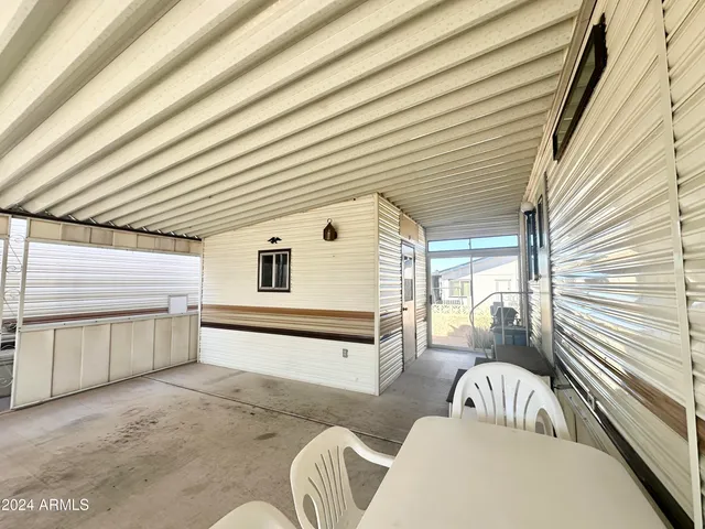 a view of a porch with furniture