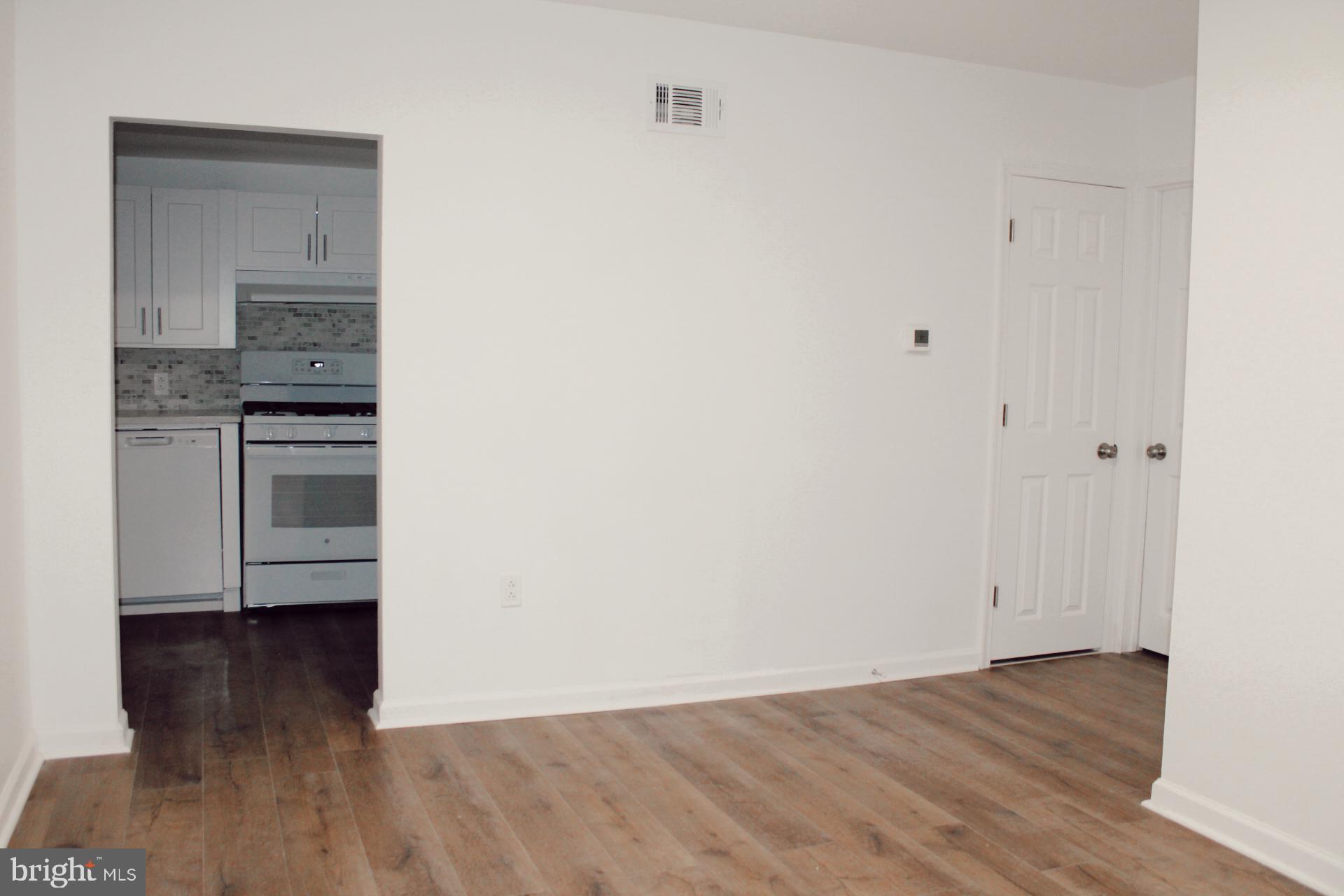 1128 West Browning Road, Unit 1 Bellmawr, NJ 08031 - Photo 5 of 19 a view of kitchen and wooden floor
