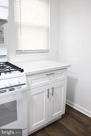 a view of washer and dryer with wooden floor