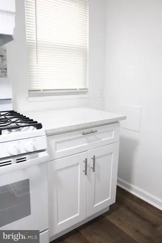 a view of washer and dryer with wooden floor