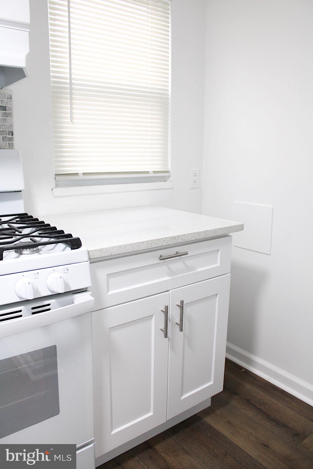 1128 West Browning Road, Unit 1 Bellmawr, NJ 08031 - Photo 10 of 19 a view of washer and dryer with wooden floor