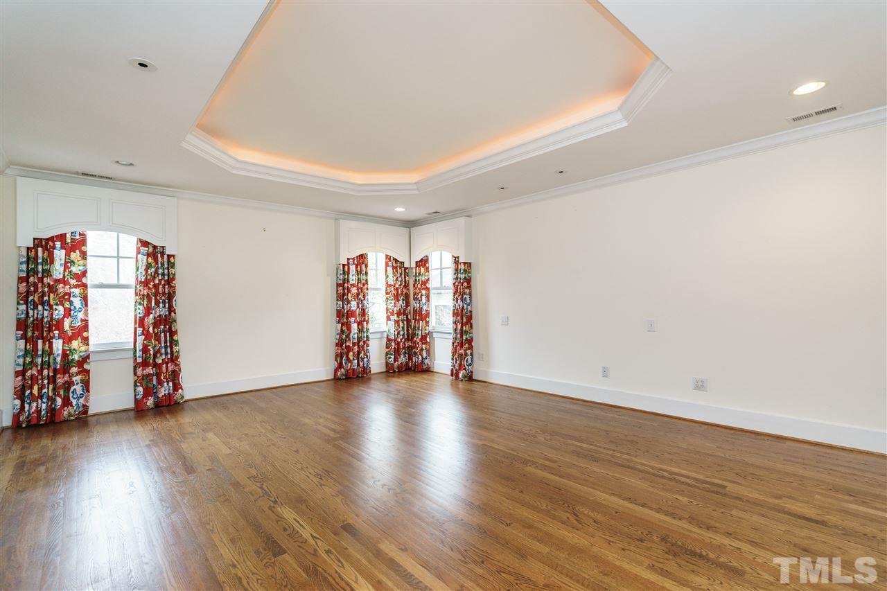 1621 St Marys Street Raleigh, NC 27608 - Photo 13 of 25 a view of an empty room with wooden floor and closet