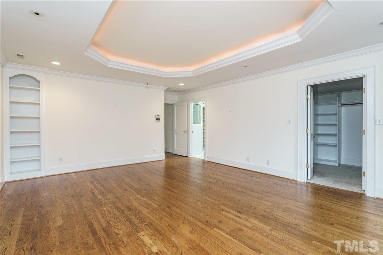 1621 St Marys Street Raleigh, NC 27608 - Photo 14 of 25 wooden floor in an empty room with a window
