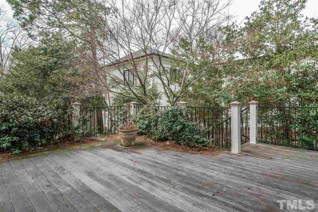 1621 St Marys Street Raleigh, NC 27608 - Photo 24 of 25 a view of outdoor space with wooden floor and trees