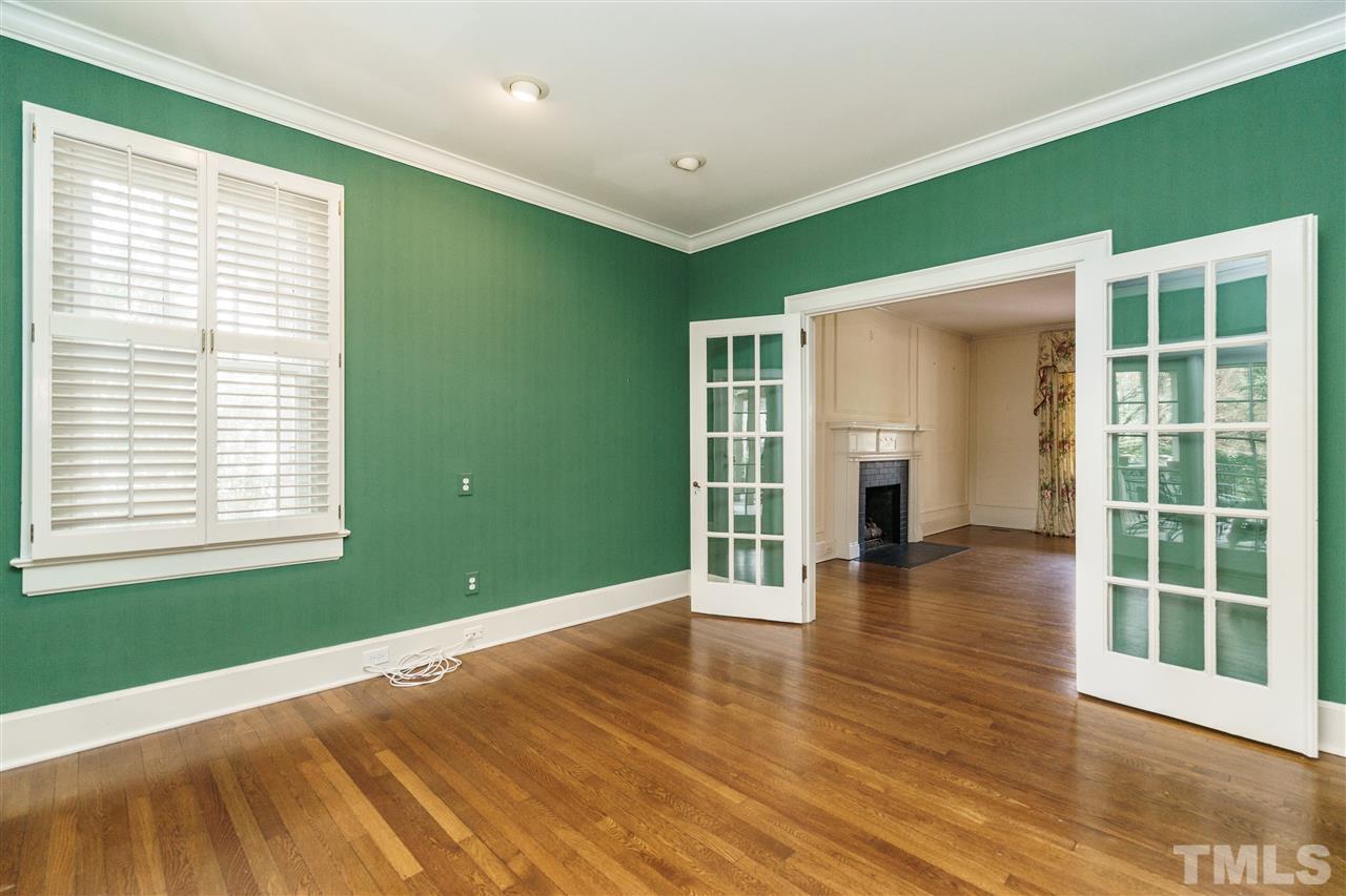 1621 St Marys Street Raleigh, NC 27608 - Photo 5 of 25 a view of empty room with wooden floor and fan