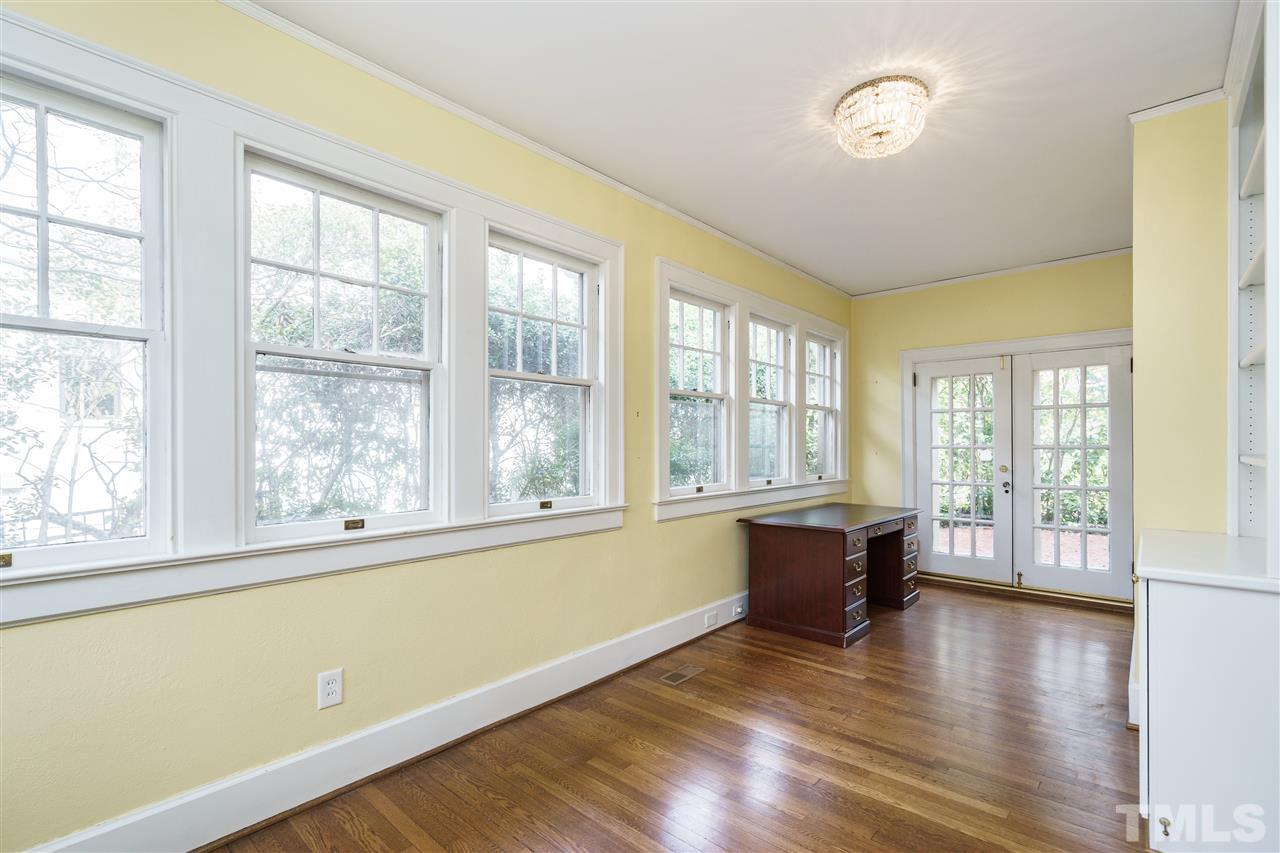 1621 St Marys Street Raleigh, NC 27608 - Photo 6 of 25 a view of empty room with wooden floor and fan
