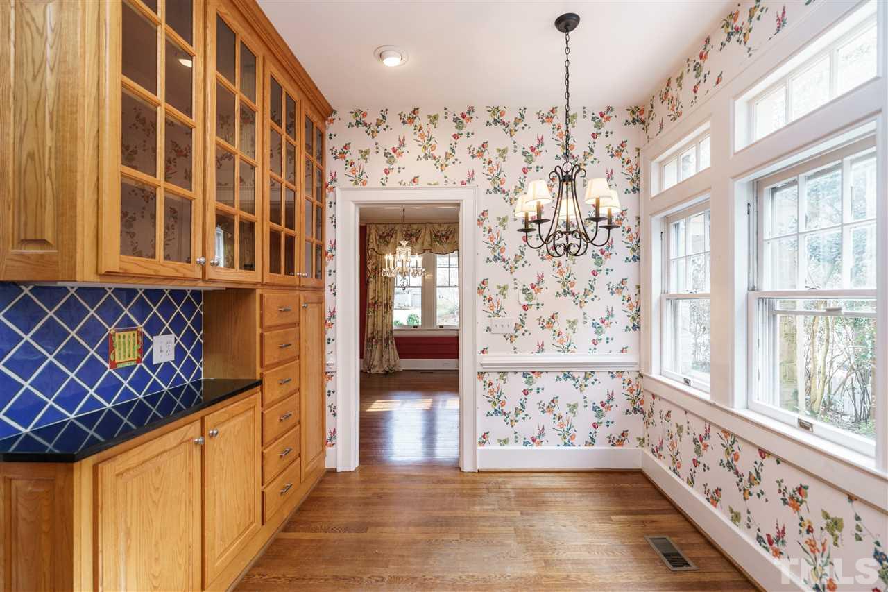 1621 St Marys Street Raleigh, NC 27608 - Photo 9 of 25 a view of a entryway door with chandelier