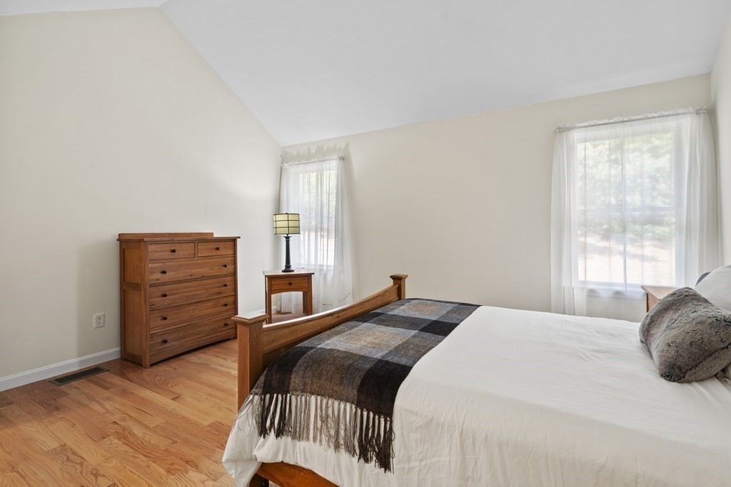 4 Strawberry Lane, Unit E Hudson, MA 01749 - Photo 12 of 40 a bedroom with a bed and a window