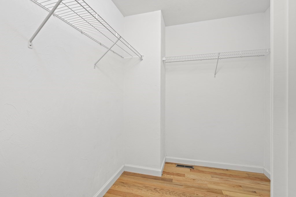 4 Strawberry Lane, Unit E Hudson, MA 01749 - Photo 13 of 40 a view of small space with racks on the wall