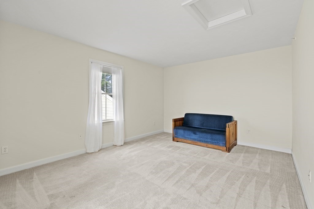 4 Strawberry Lane, Unit E Hudson, MA 01749 - Photo 24 of 40 an empty room with a window