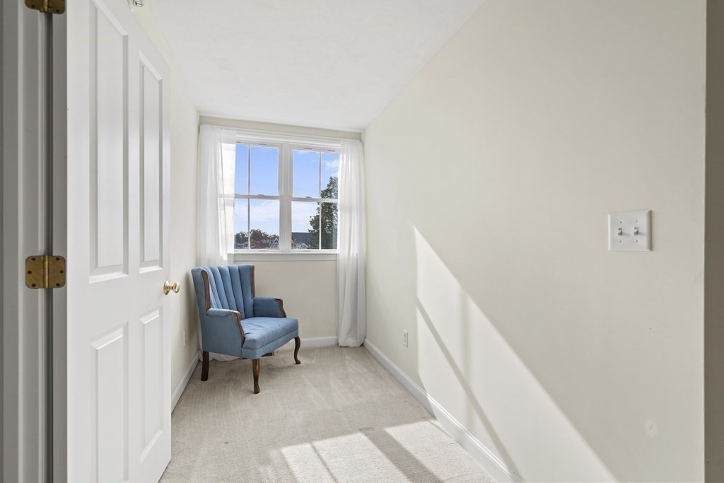 4 Strawberry Lane, Unit E Hudson, MA 01749 - Photo 26 of 40 a room with furniture and windows