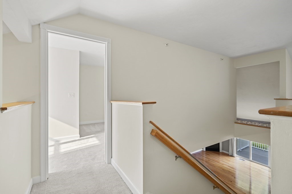 4 Strawberry Lane, Unit E Hudson, MA 01749 - Photo 29 of 40 a view of a kitchen from the hallway