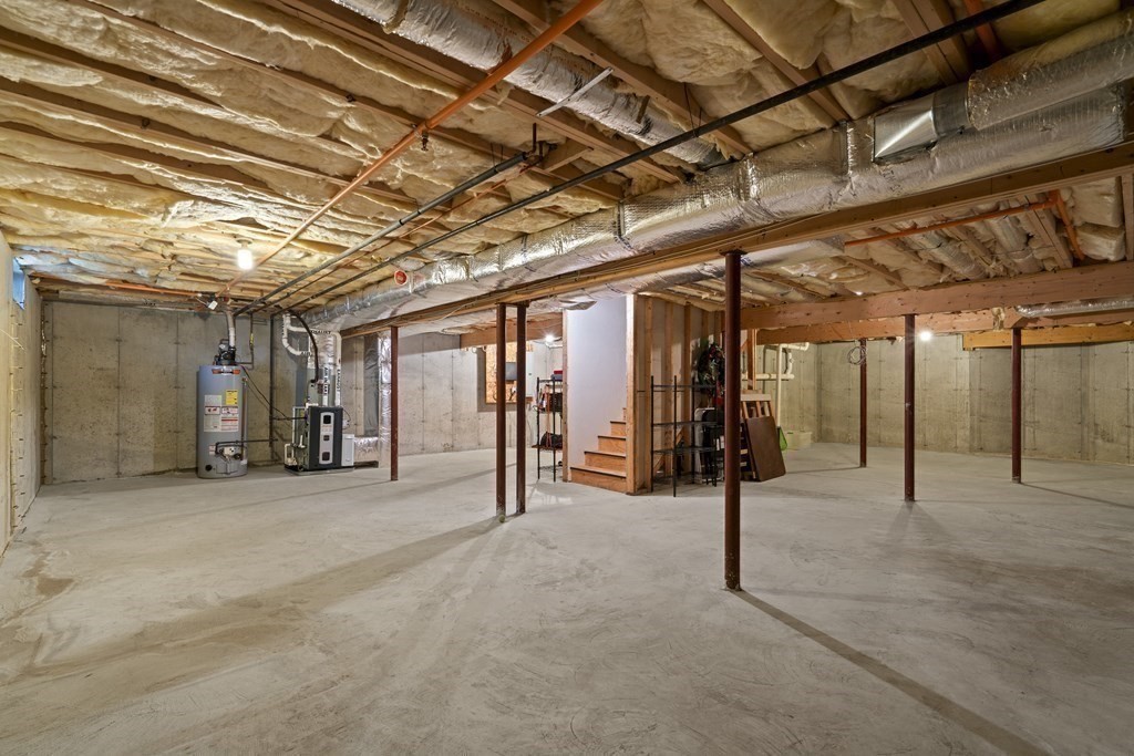 4 Strawberry Lane, Unit E Hudson, MA 01749 - Photo 33 of 40 a view of a room with wooden roof
