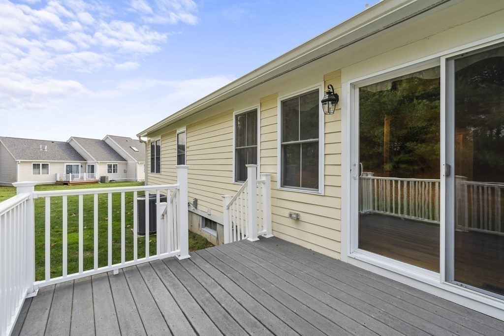 4 Strawberry Lane, Unit E Hudson, MA 01749 - Photo 36 of 40 a view of a house with a deck