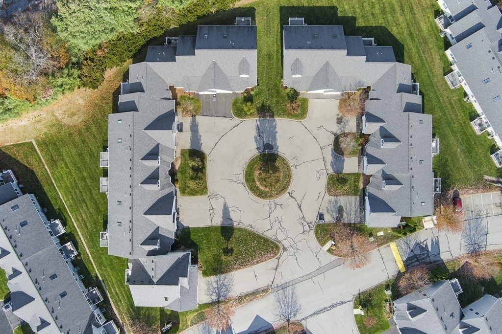 4 Strawberry Lane, Unit E Hudson, MA 01749 - Photo 39 of 40 an aerial view of house with yard and swimming pool