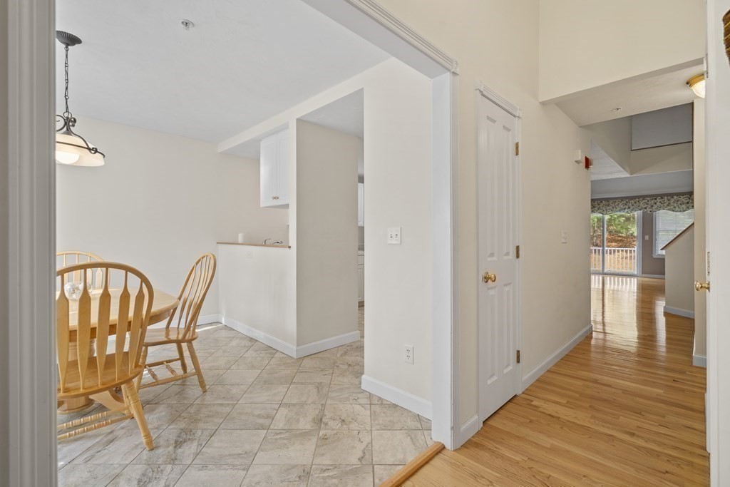 4 Strawberry Lane, Unit E Hudson, MA 01749 - Photo 5 of 40 a view of a livingroom with furniture and wooden floor