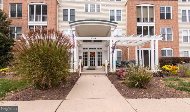 a front view of a building with garden