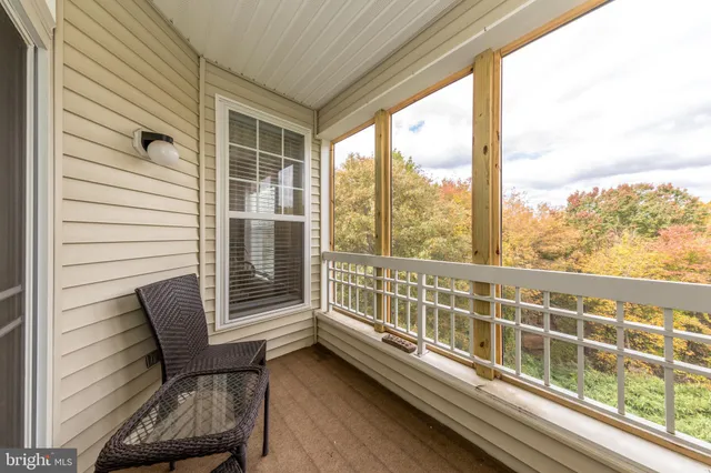 a view of two chairs in balcony