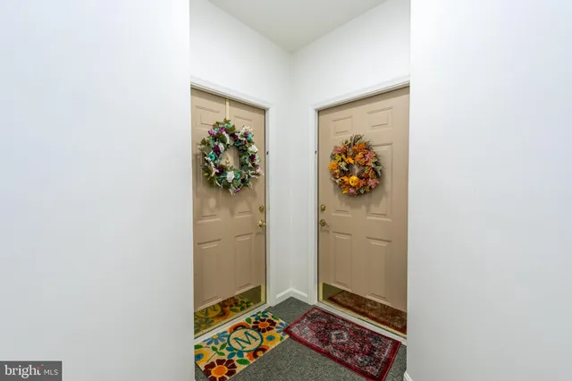 a view of a hallway with workspace